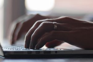 Man typing on keyboard