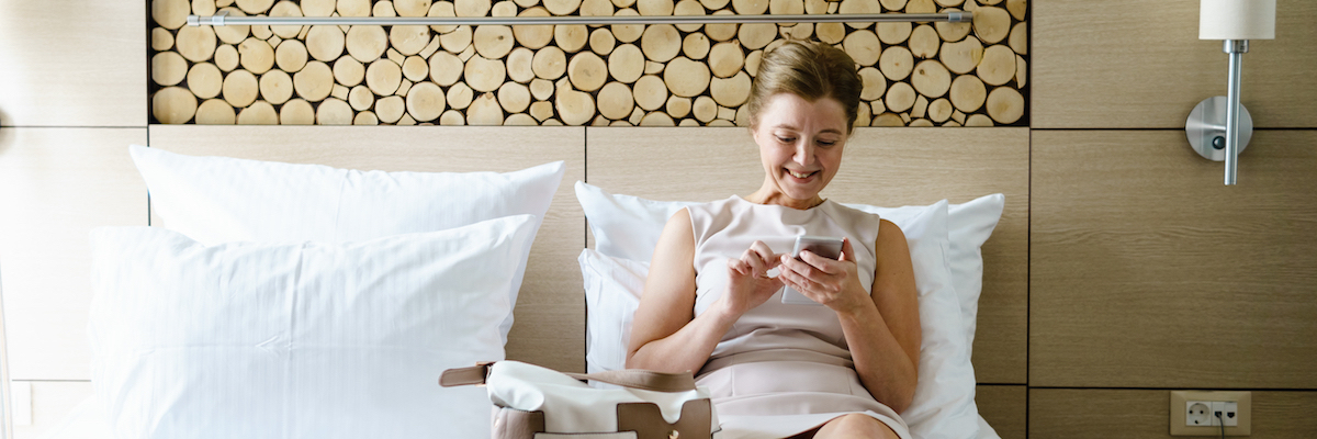 Happy woman in hotel room