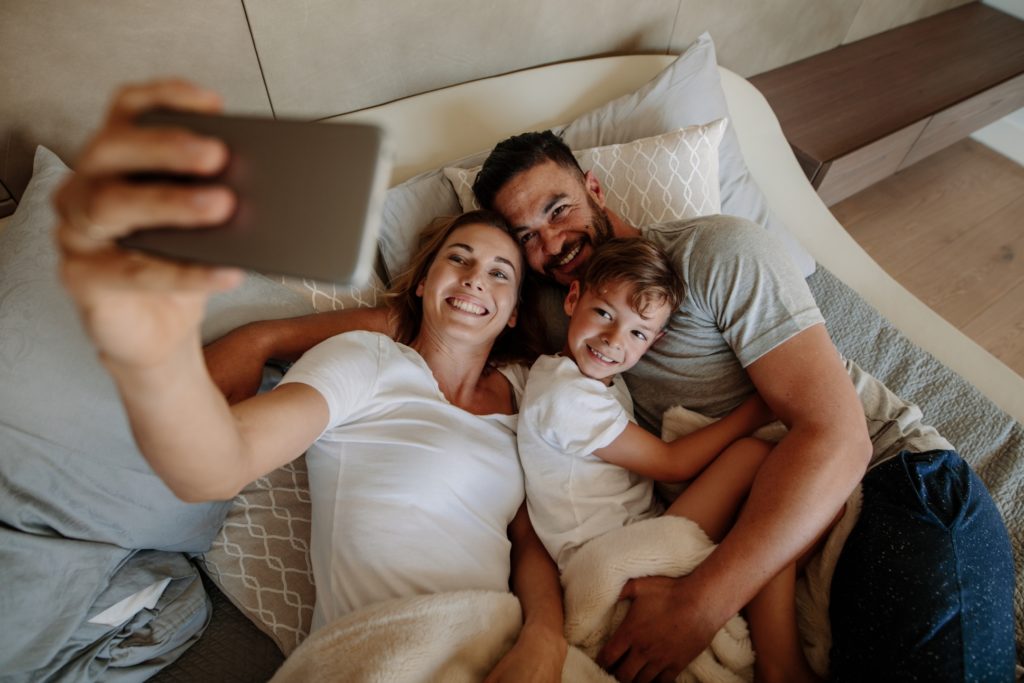 Family Taking a Selfie at a Hotel