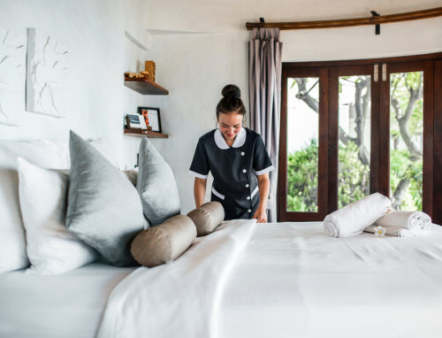 Housekeeper cleaning a hotel room