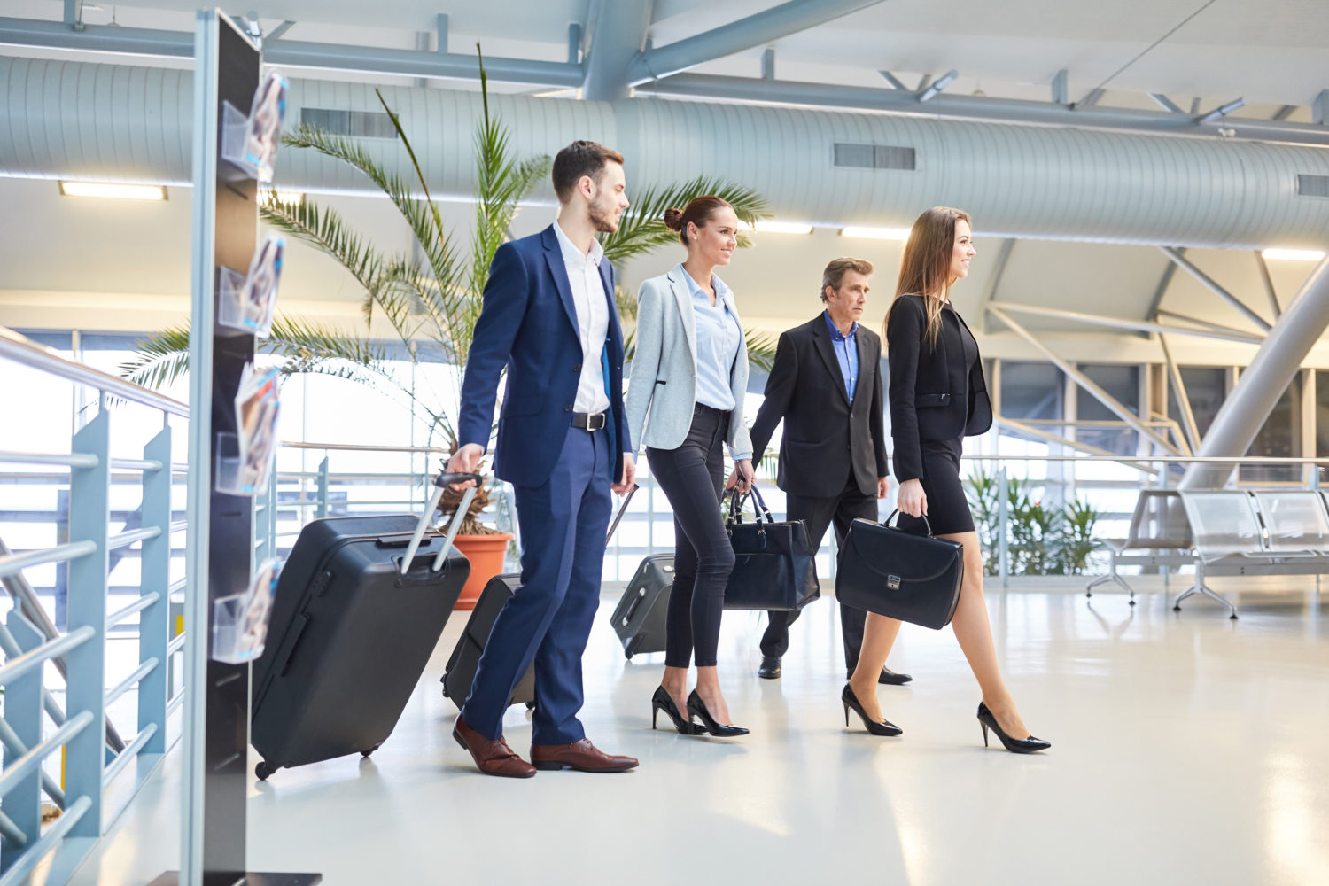 flight crew walking through an airport terminal