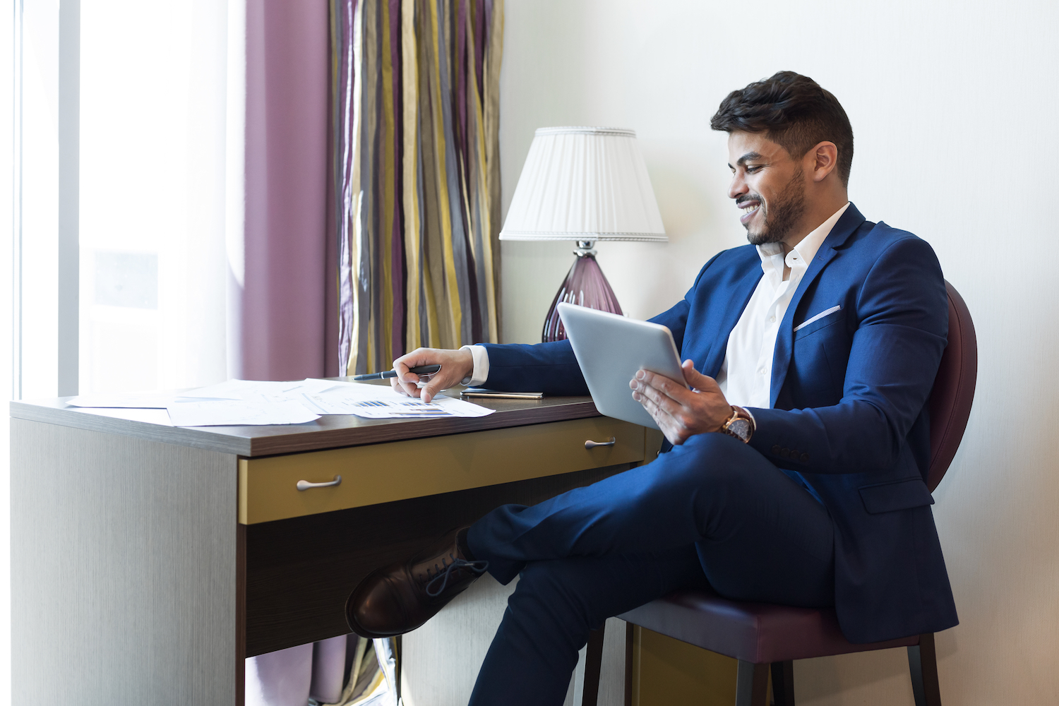 Businessman Working in a Hotel Room