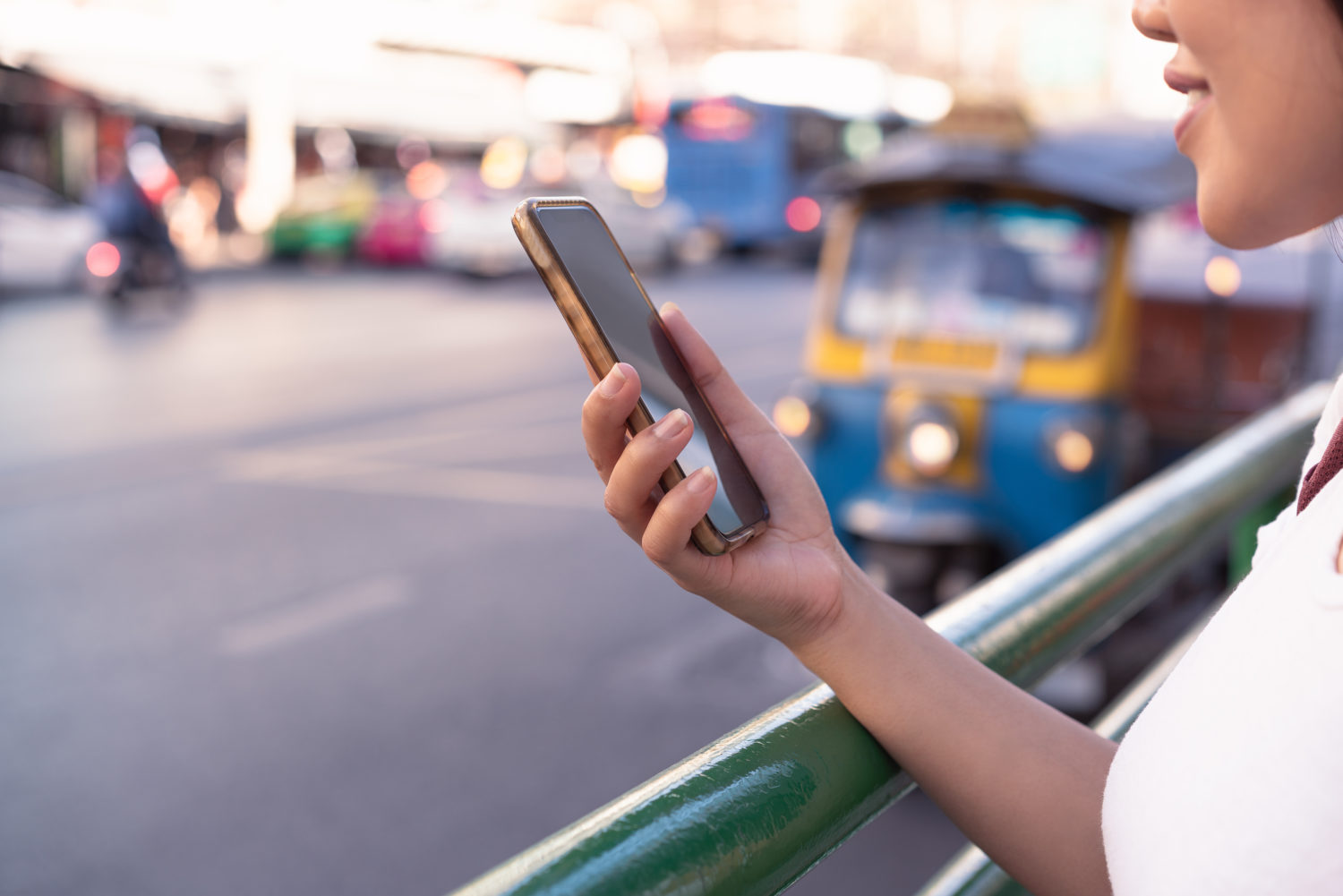 Woman holding her phone using social media