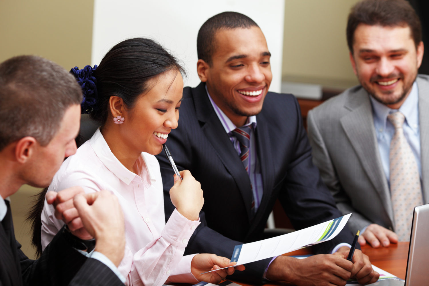 Diverse group of employees mid-discussion