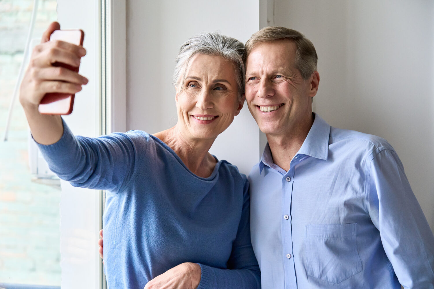 older couple taking a selfie