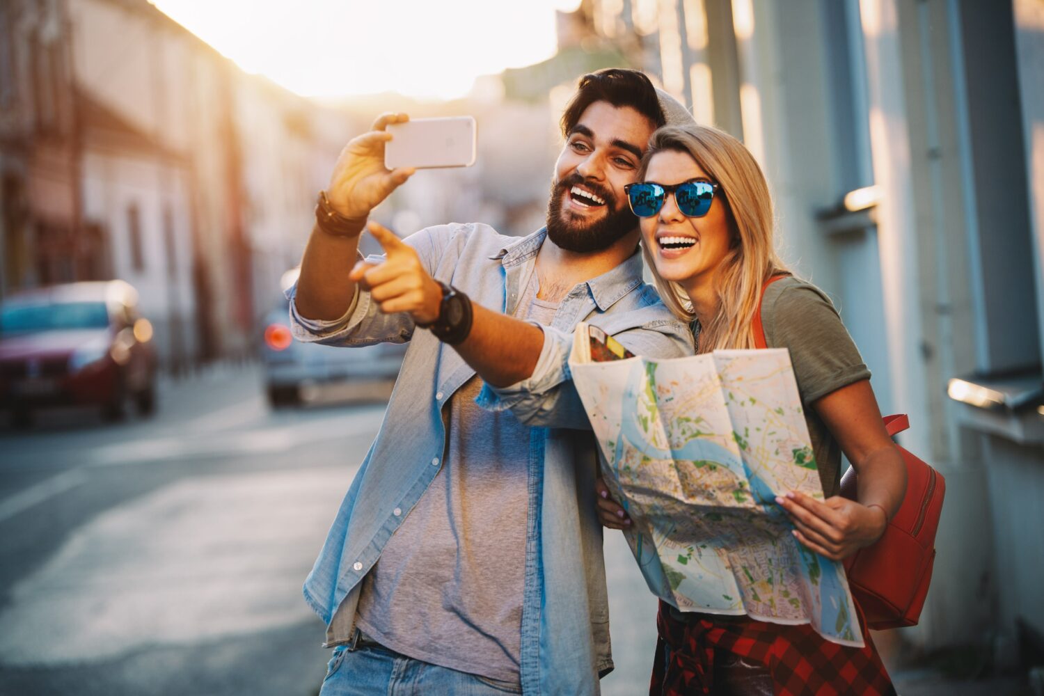 man and his girlfriend standing together taking a selfie
