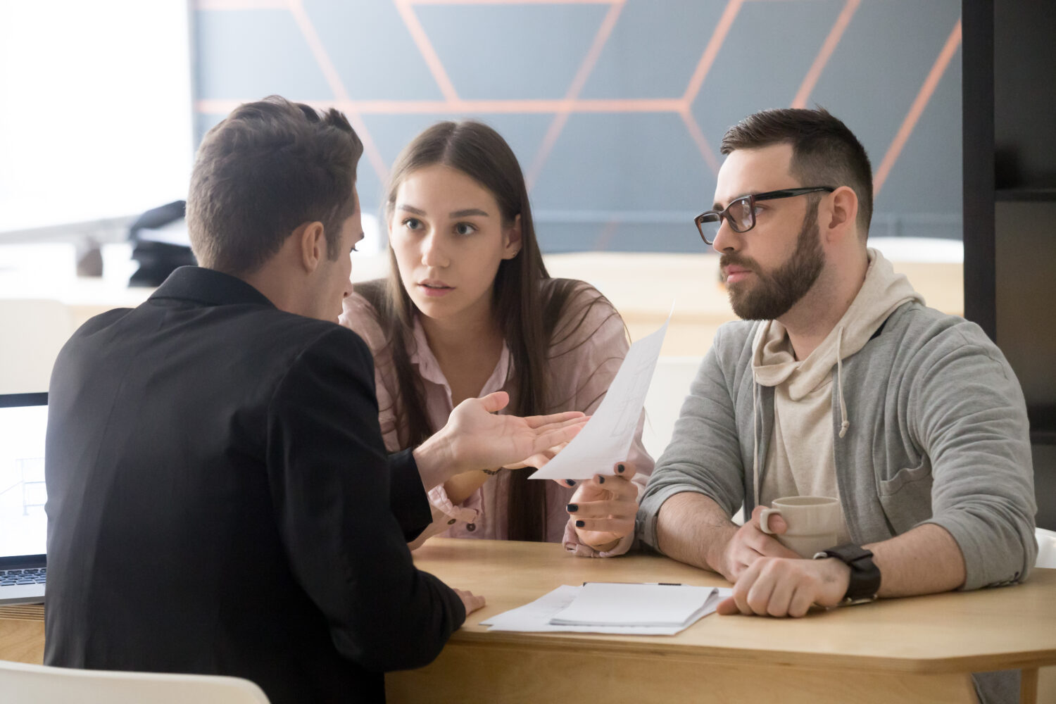 angry couple arguing with customer service agent