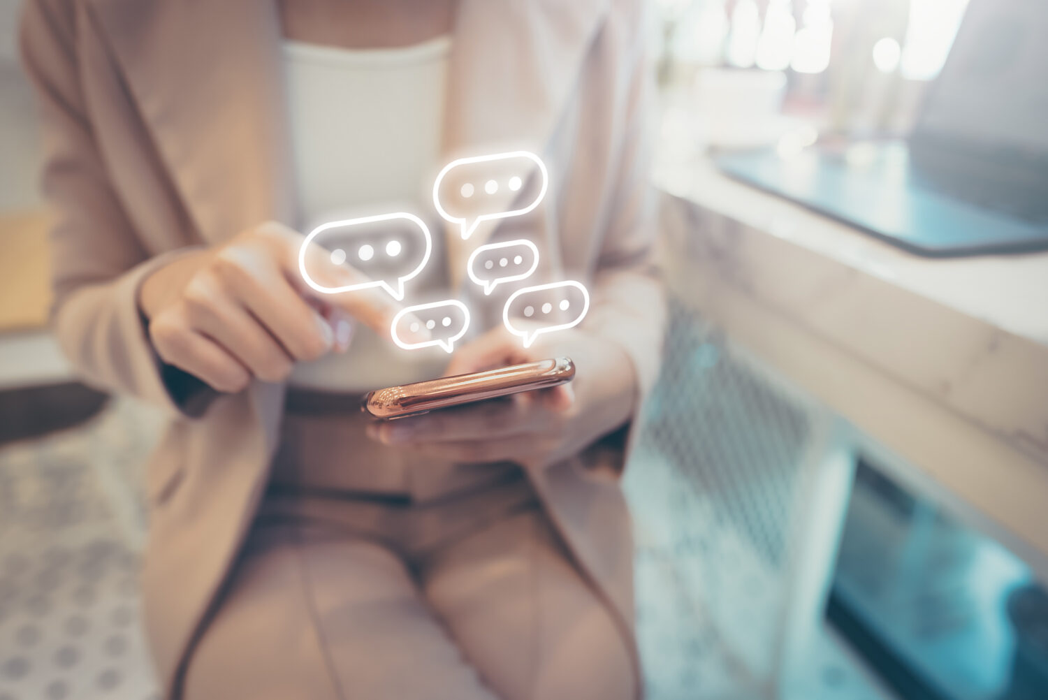 woman using mobile phone with message notifications floating upward