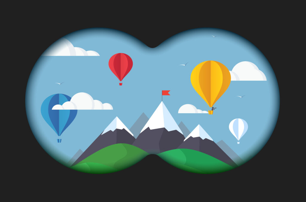 binocular view of mountains with hot air balloons